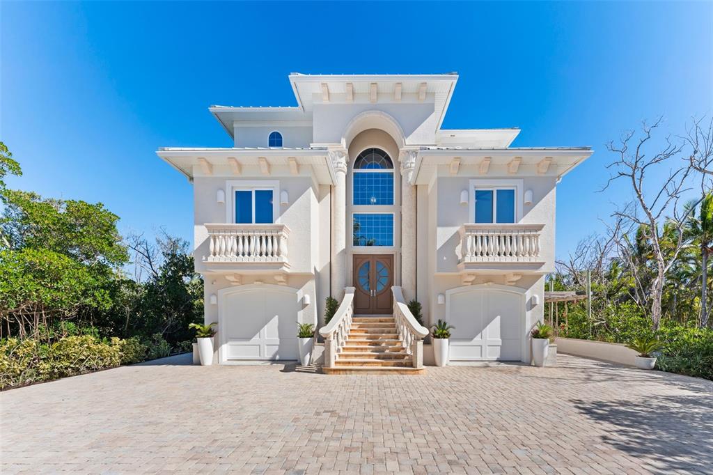 4150 Snail Island Court Boca Grande, FL 33921 - Photo 9 of 98 a view of a house with a patio