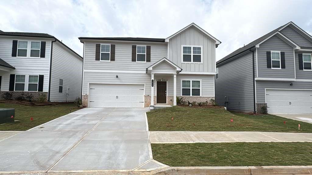 a front view of a house with a yard