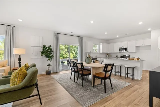 a dining room with furniture and window