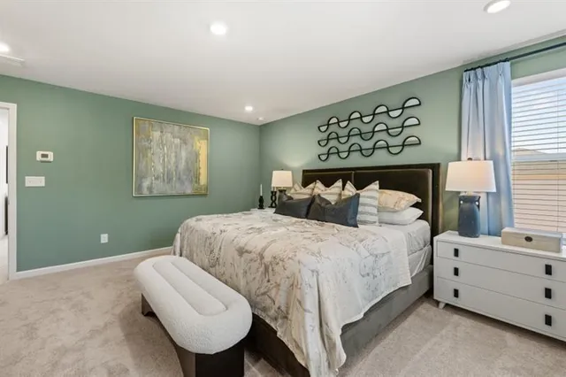 a bedroom with a bed and a dresser