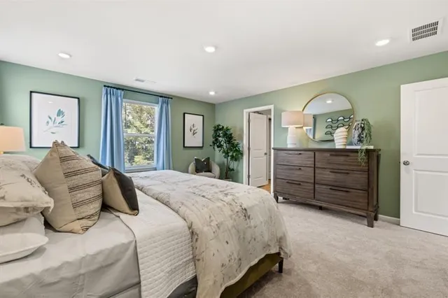 a spacious bathroom with a double vanity sink and mirror
