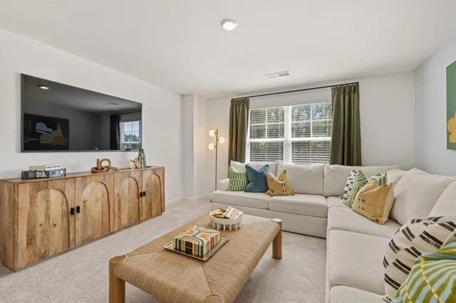 a living room with furniture and a couch