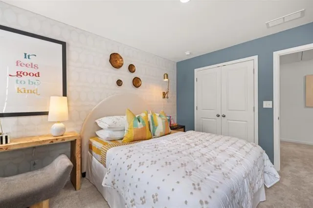 a bed room with a bed and a night stand