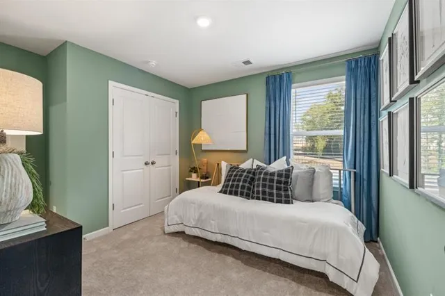 a bedroom with a bed and window