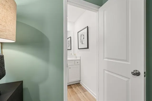 a bathroom with a granite countertop sink a toilet and shower