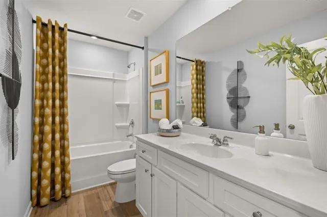 a view of a house with backyard and garage