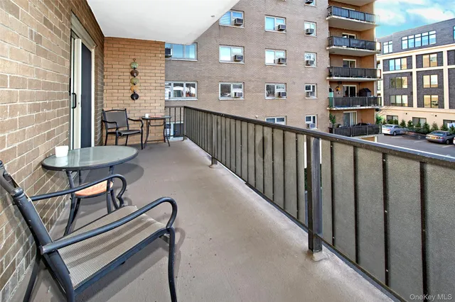 a view of a balcony with chairs