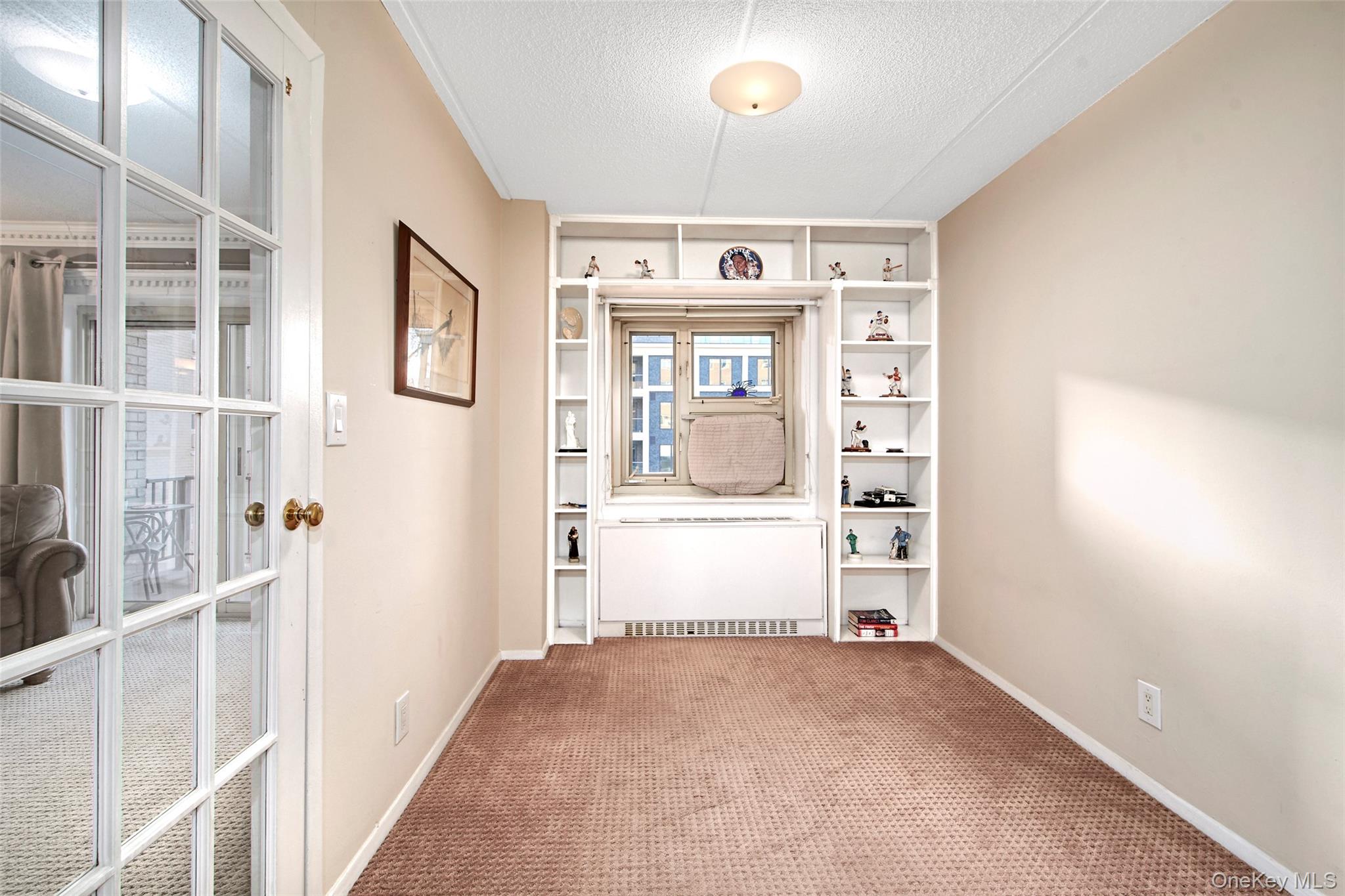 470 Halstead Avenue, Unit 2T Harrison, NY 10528 - Photo 13 of 23 a view of a hallway to an empty room and window