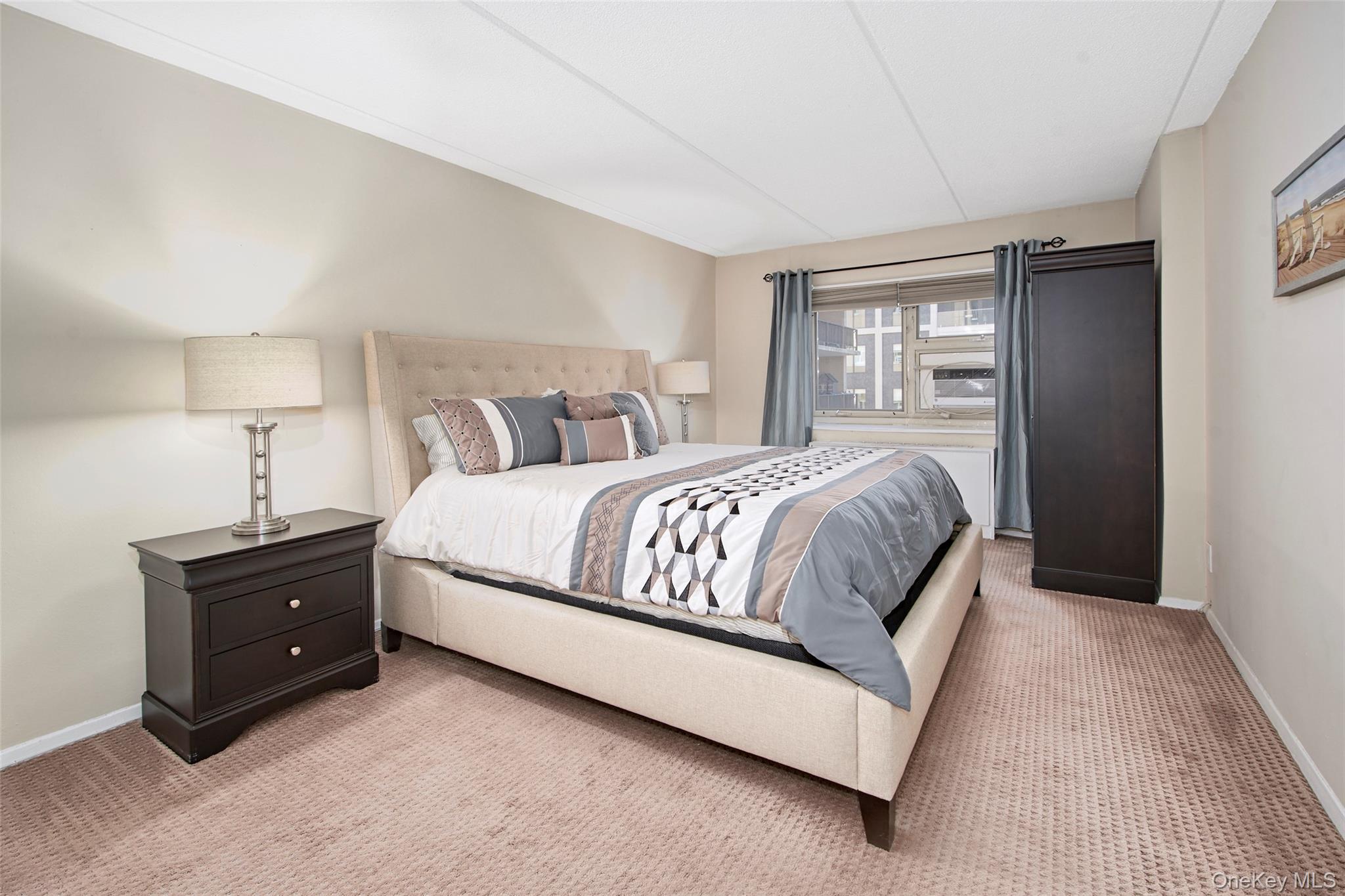 470 Halstead Avenue, Unit 2T Harrison, NY 10528 - Photo 18 of 23 a bedroom with a bed and lamp