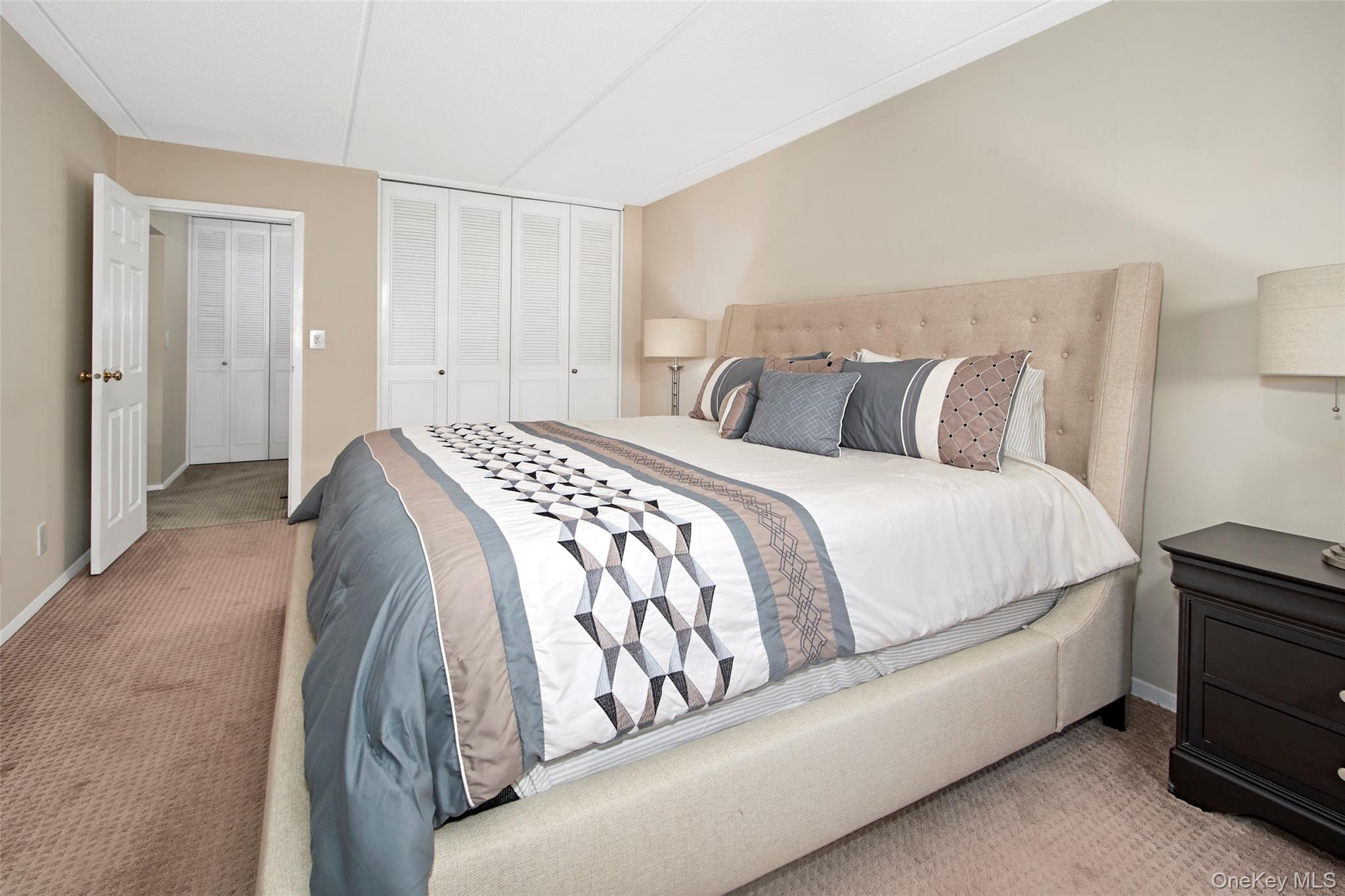 470 Halstead Avenue, Unit 2T Harrison, NY 10528 - Photo 19 of 23 a spacious bedroom with a bed and a closet