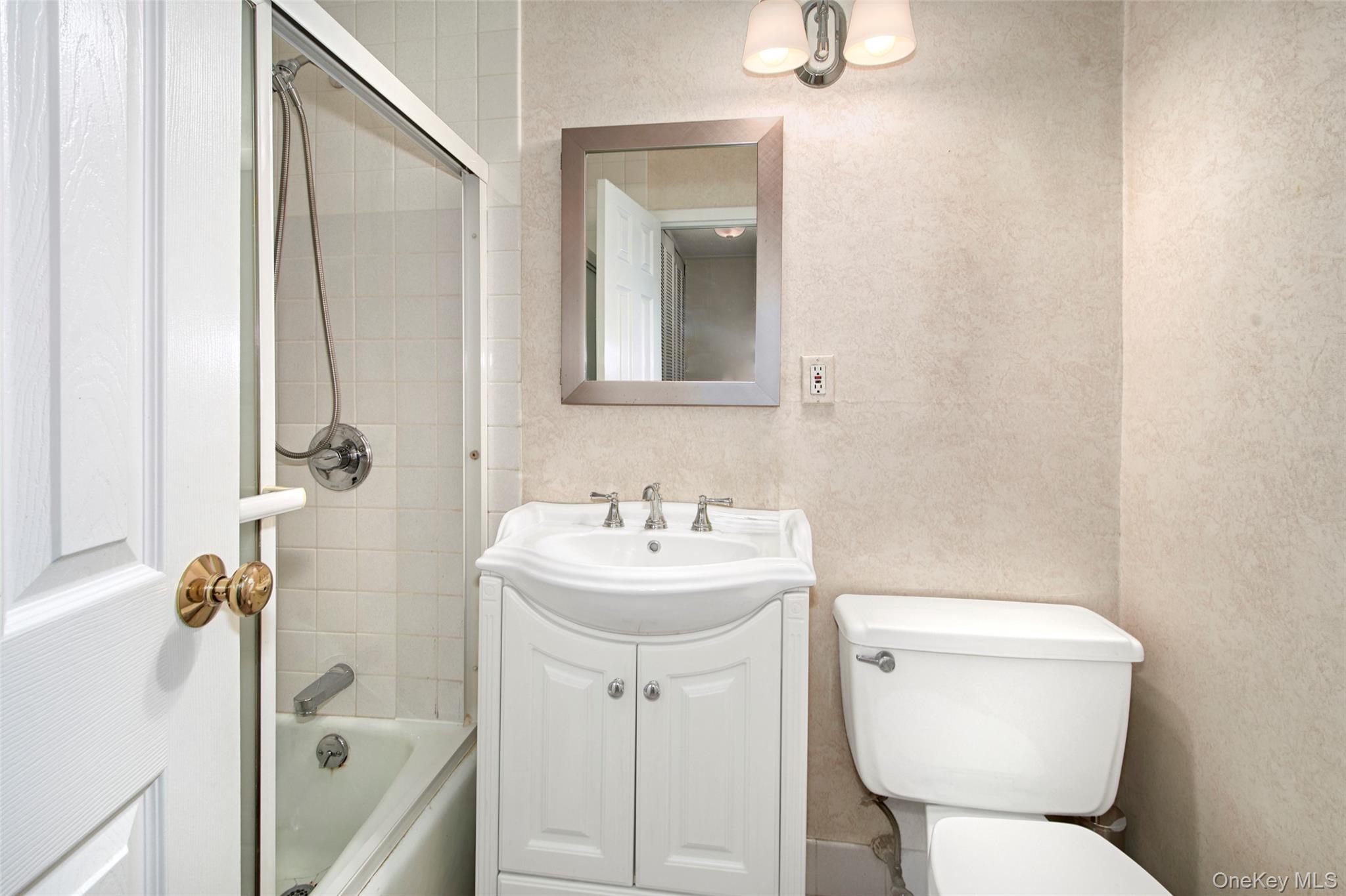 470 Halstead Avenue, Unit 2T Harrison, NY 10528 - Photo 20 of 23 a bathroom with a sink a toilet and shower