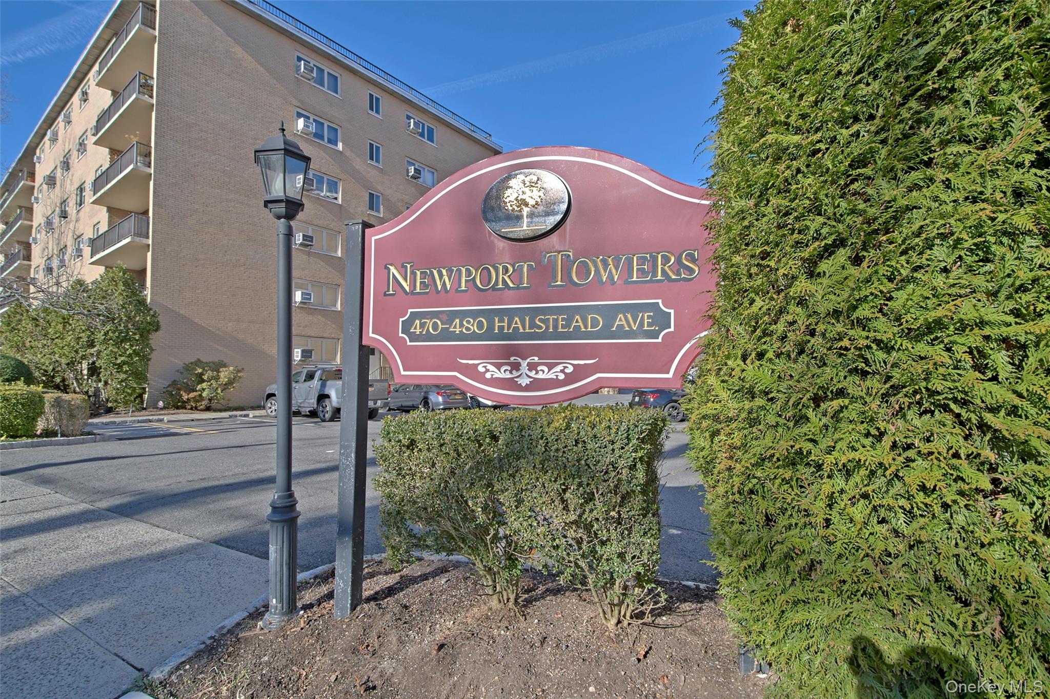 470 Halstead Avenue, Unit 2T Harrison, NY 10528 - Photo 2 of 23 a sign that is on a brick wall