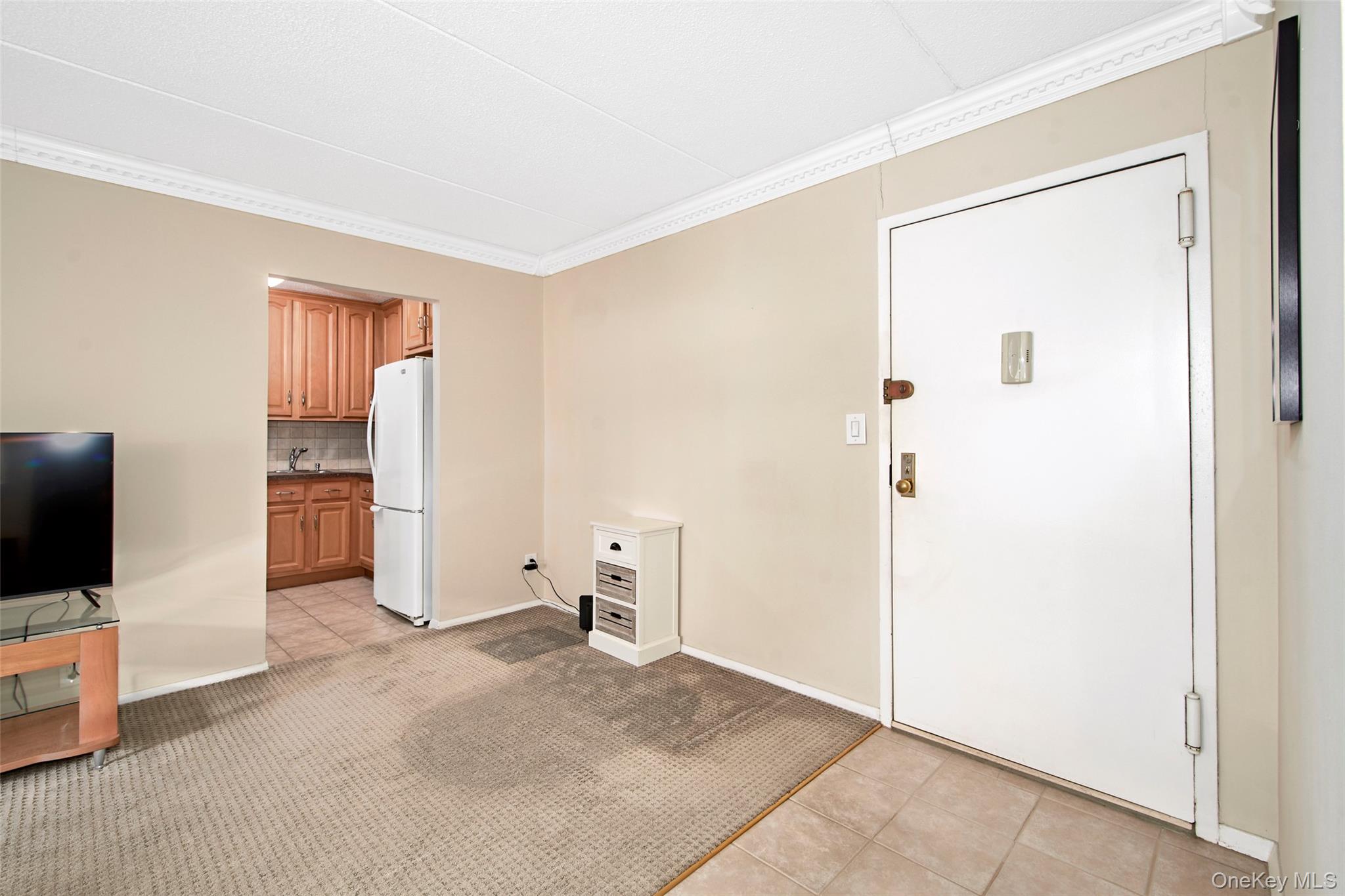 470 Halstead Avenue, Unit 2T Harrison, NY 10528 - Photo 5 of 23 a view of a livingroom with an empty space and a bedroom