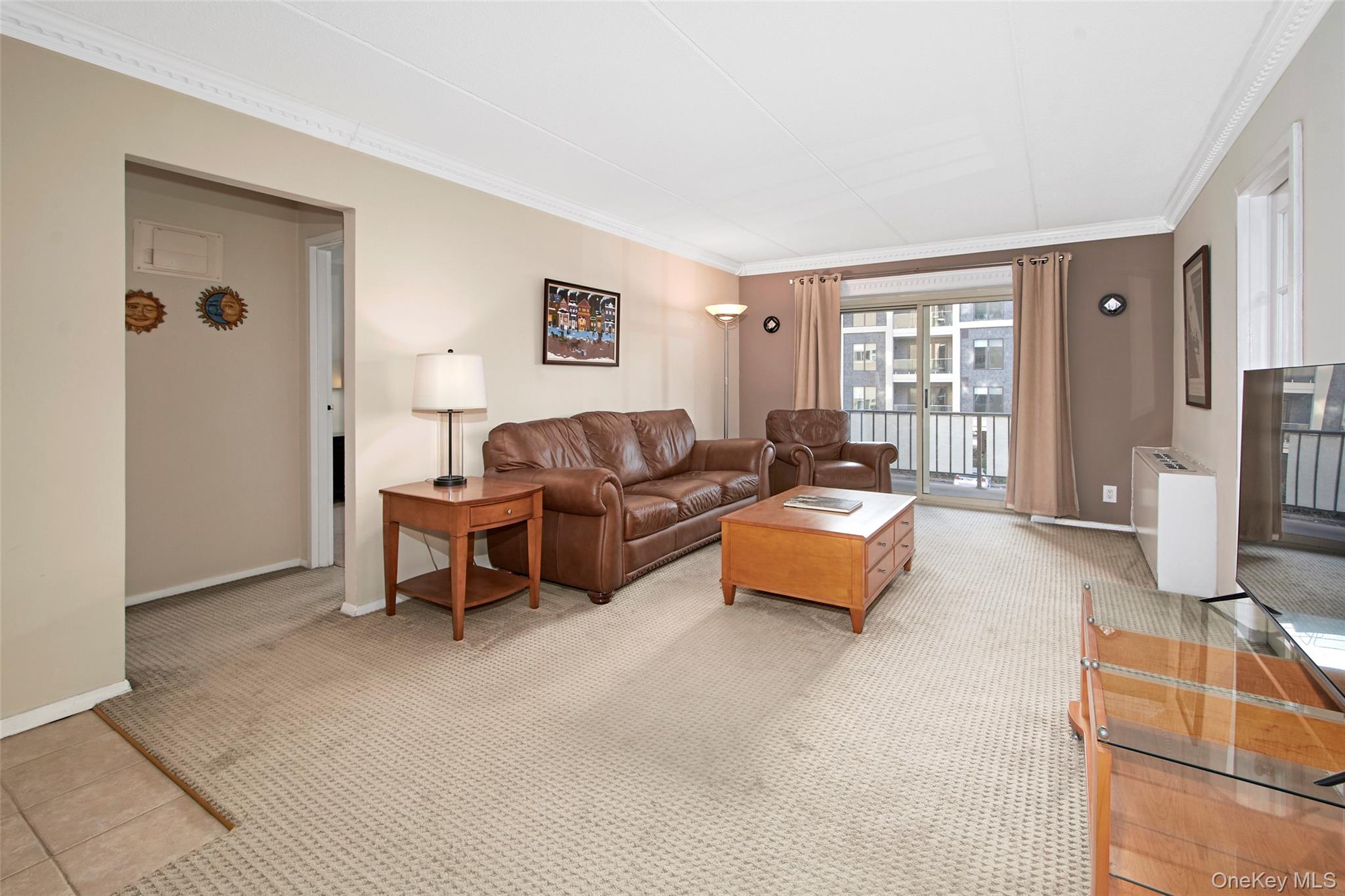 470 Halstead Avenue, Unit 2T Harrison, NY 10528 - Photo 10 of 23 a living room with furniture and a window