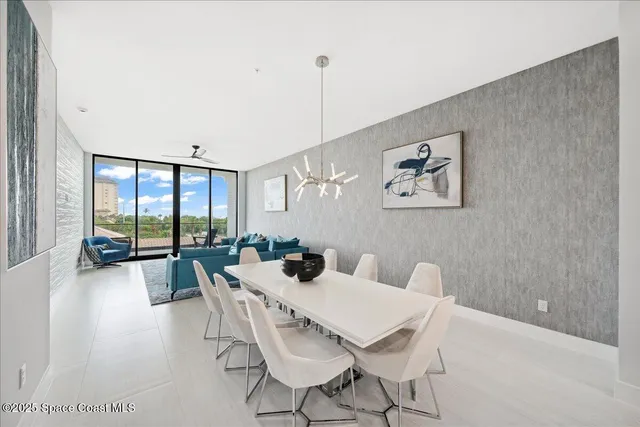 a view of a dining room with furniture and window