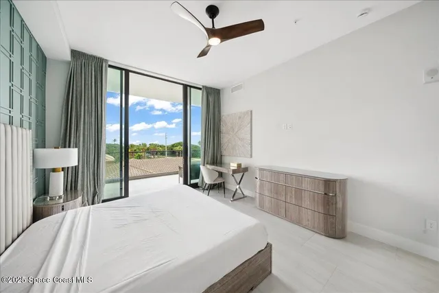 a bathroom with a tub a mirror and a shower