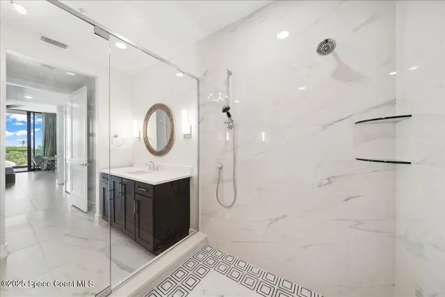 a large white bed in a white room