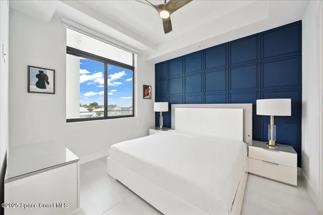 a en suite bathroom with a double vanity sink and a mirror