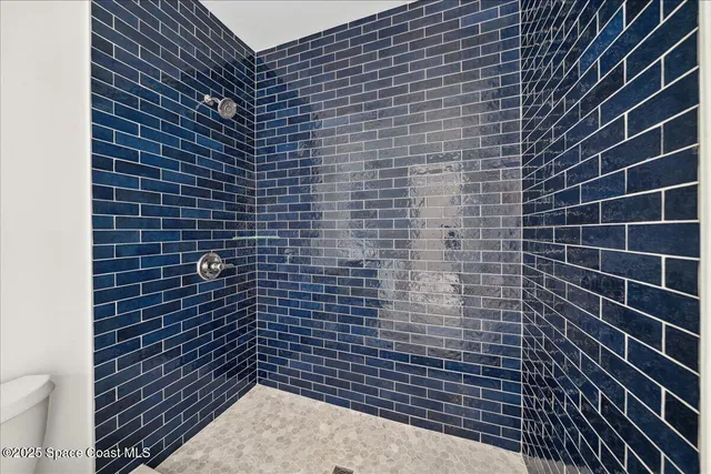 a view of a street with a building in the background