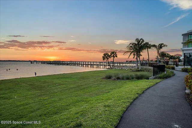 a view of a porch with wooden floor and fence