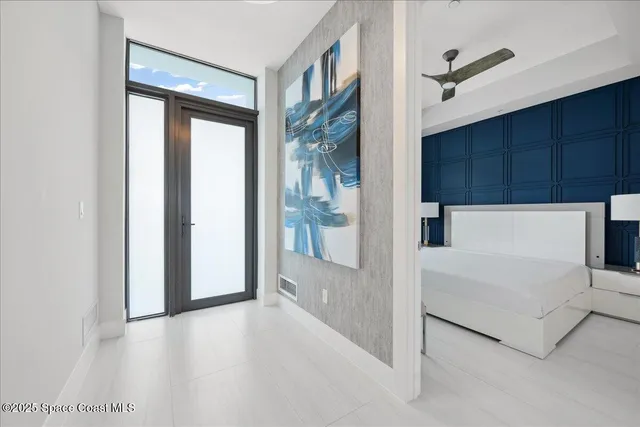 a kitchen with stainless steel appliances kitchen island a table chairs sink and cabinets