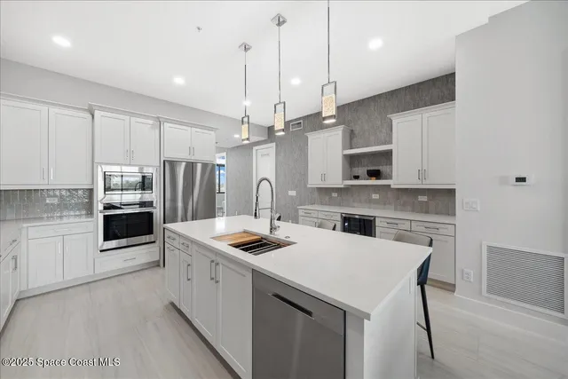 a kitchen with cabinets and window