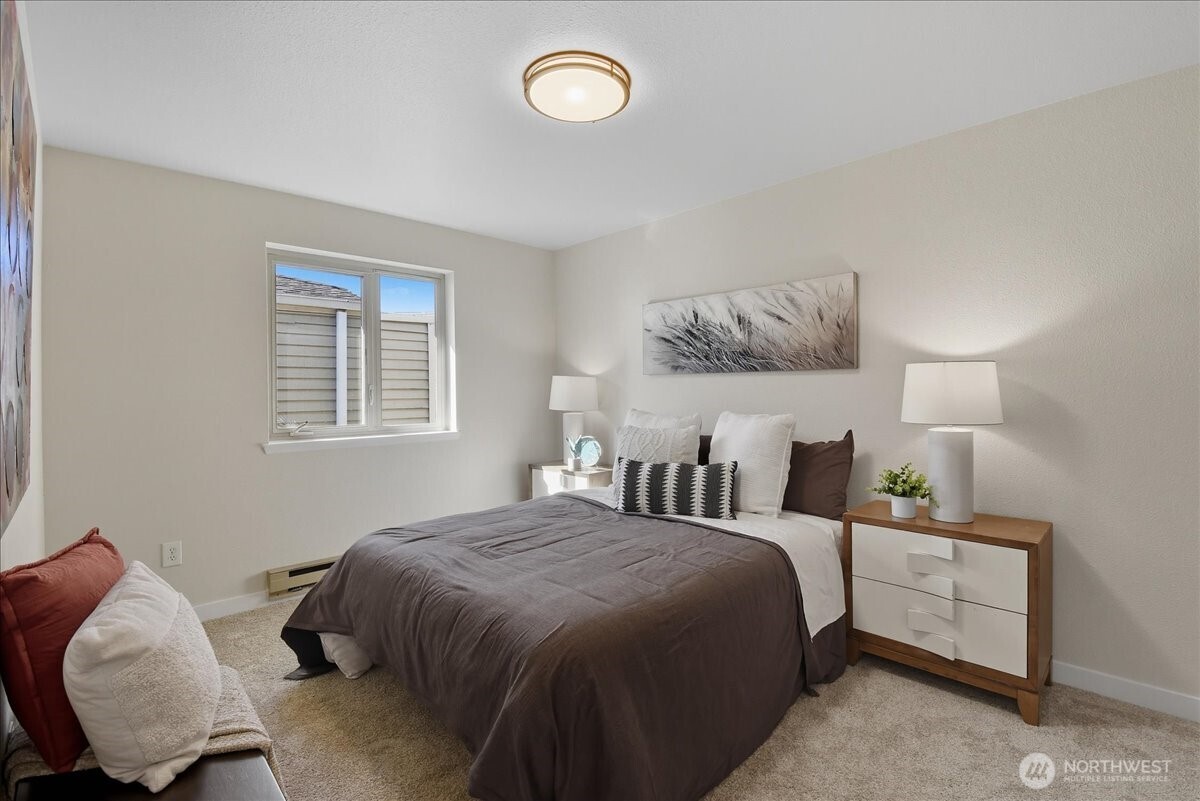 18150 73rd Avenue Northeast, Unit B306 Kenmore, WA 98028 - Photo 15 of 32 a bedroom with a bed and window