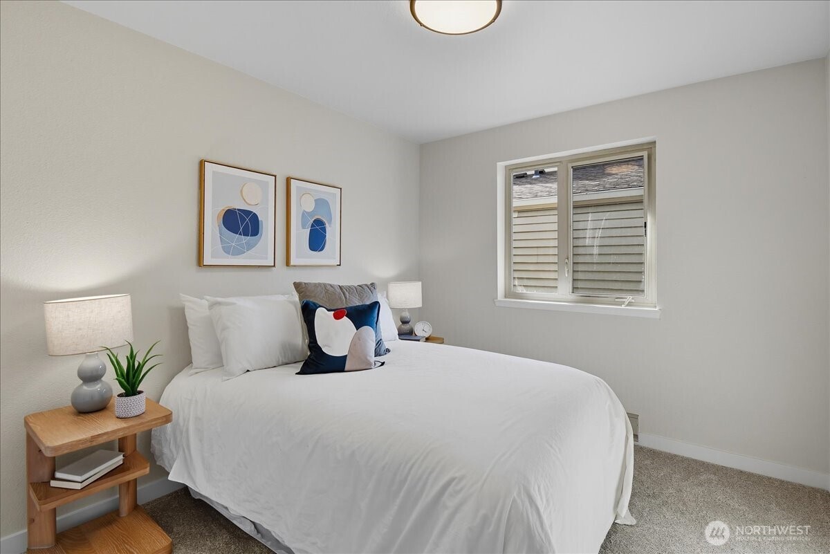 18150 73rd Avenue Northeast, Unit B306 Kenmore, WA 98028 - Photo 17 of 32 a bedroom with a bed and a window