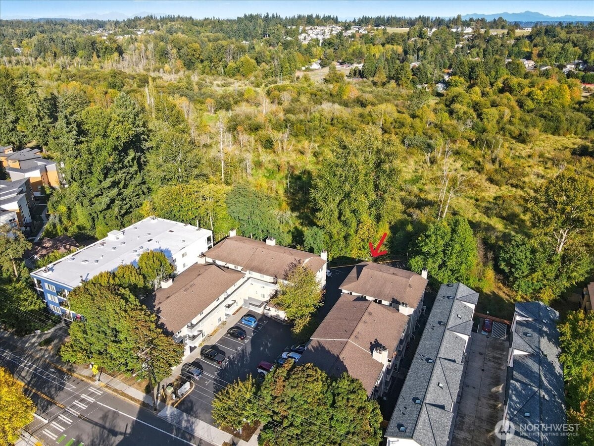 18150 73rd Avenue Northeast, Unit B306 Kenmore, WA 98028 - Photo 22 of 32 an aerial view of residential houses with outdoor space
