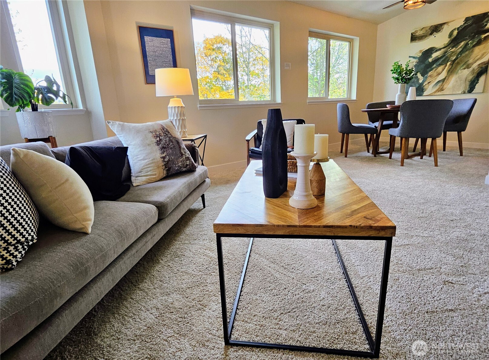 18150 73rd Avenue Northeast, Unit B306 Kenmore, WA 98028 - Photo 24 of 32 a living room with furniture and a table