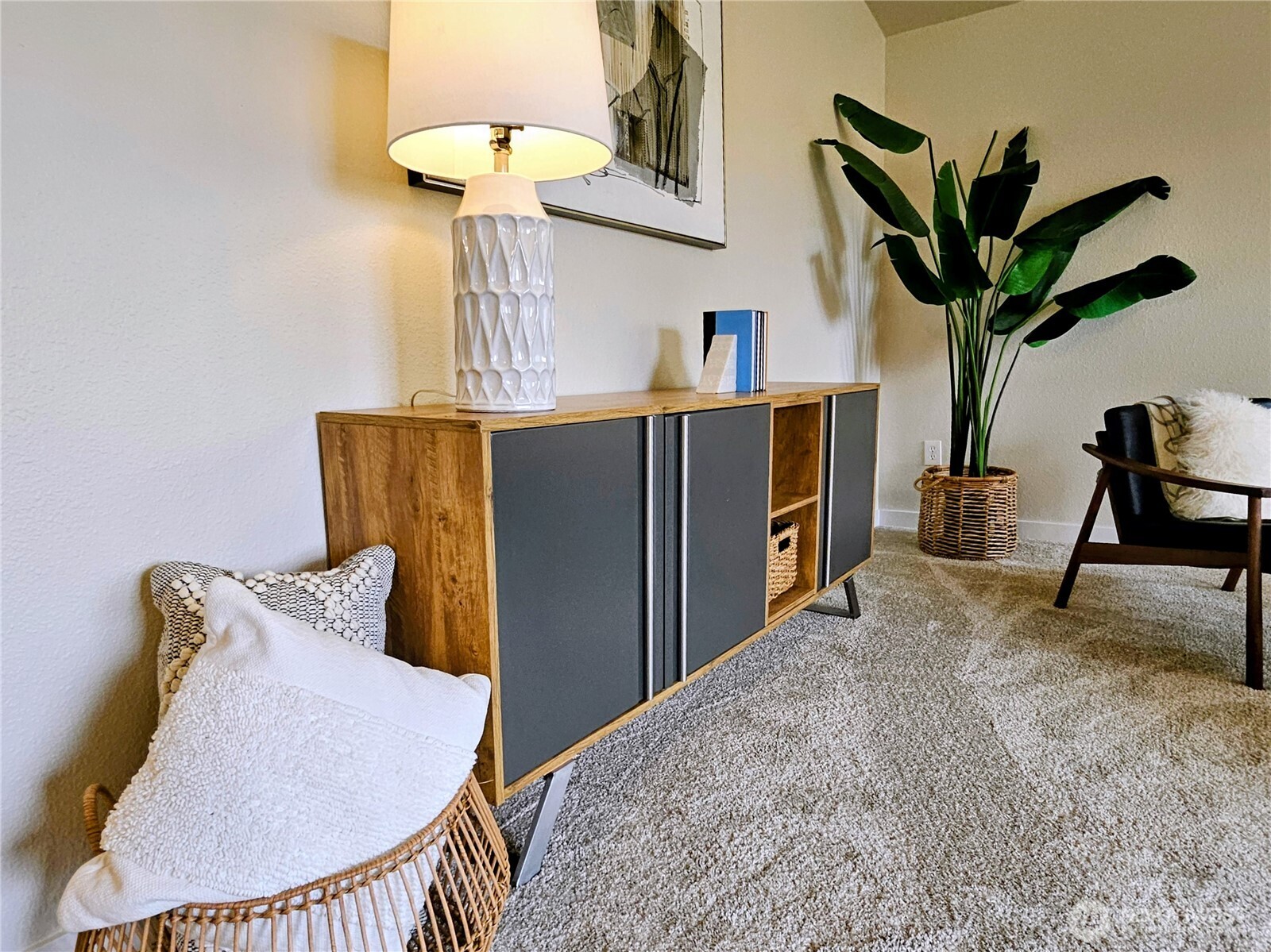 18150 73rd Avenue Northeast, Unit B306 Kenmore, WA 98028 - Photo 31 of 32 a bedroom with furniture and a chandelier