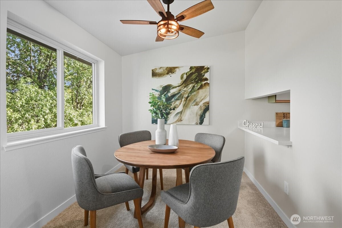 18150 73rd Avenue Northeast, Unit B306 Kenmore, WA 98028 - Photo 9 of 32 a dining room with furniture and window