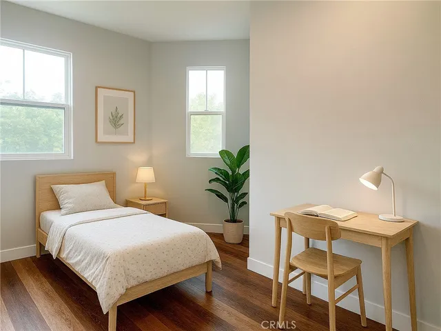 a bedroom with a bed and a table