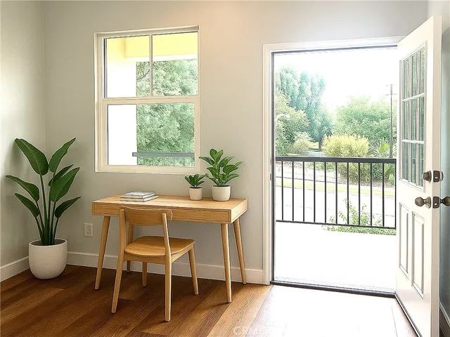 a view of a dining room with furniture window and wooden floor