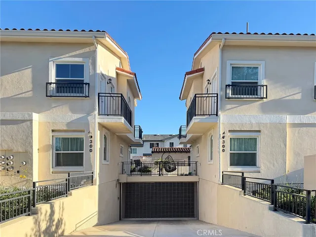 a front view of a house with large windows