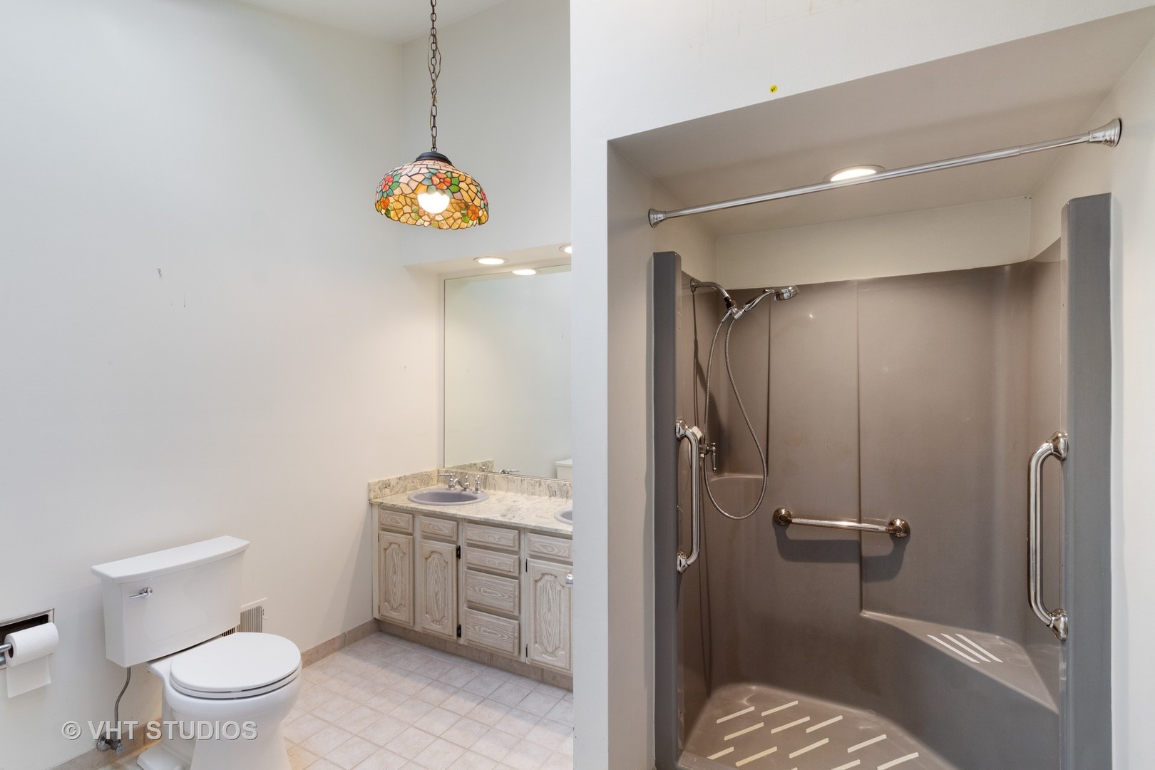 67 Round Barn Road Barrington Hills, IL 60010 - Photo 14 of 43 a bathroom with a sink a toilet and shower