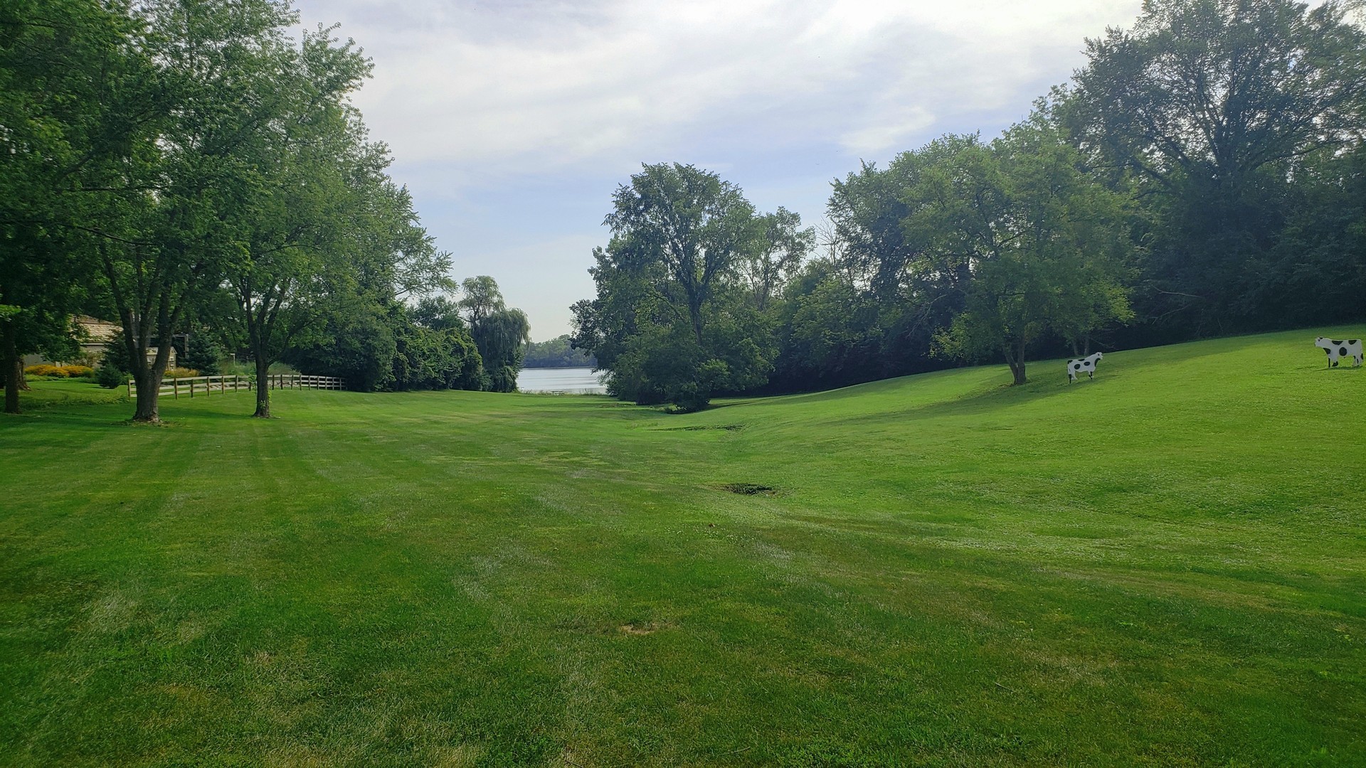 67 Round Barn Road Barrington Hills, IL 60010 - Photo 3 of 43 a view of a grassy field with trees
