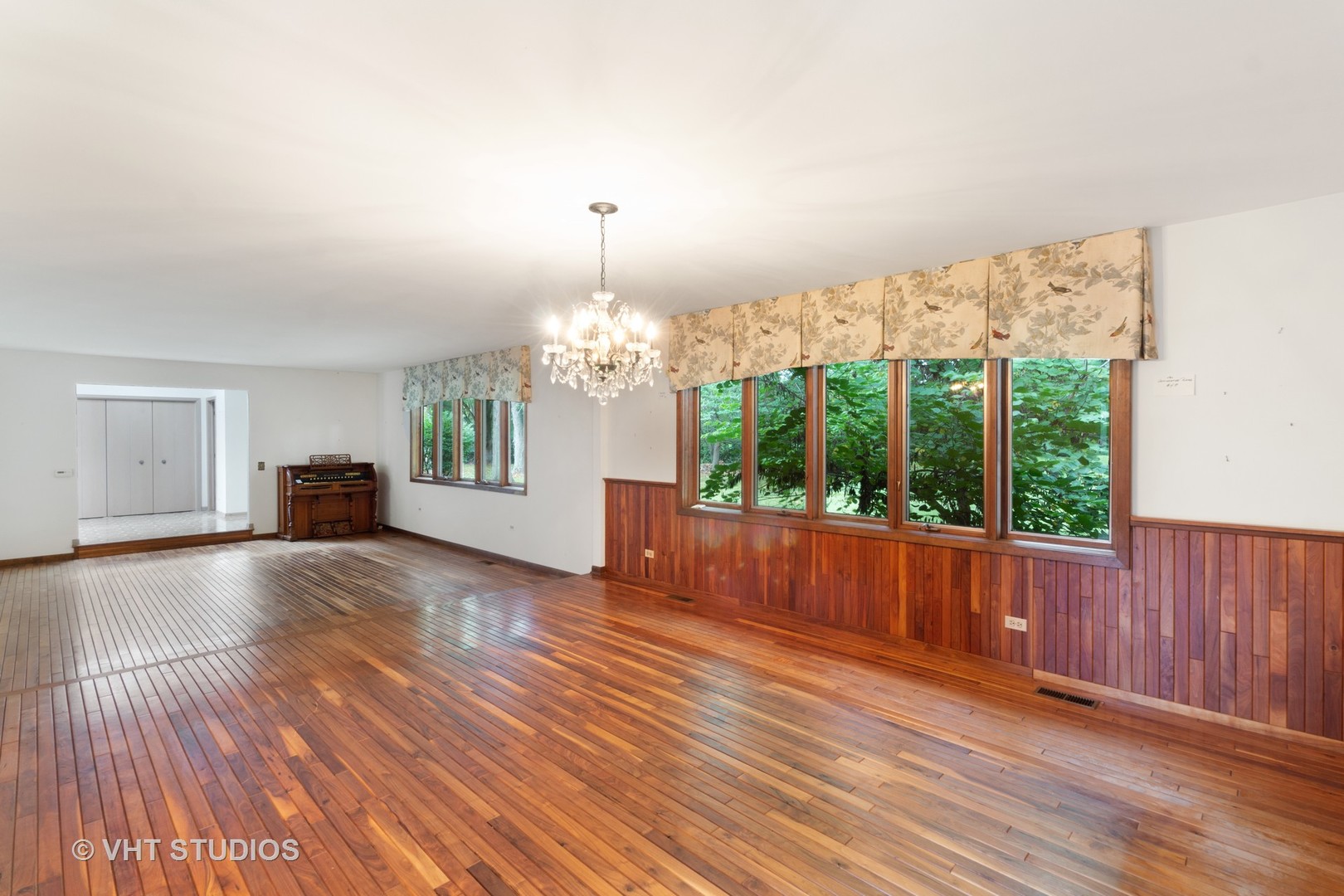 67 Round Barn Road Barrington Hills, IL 60010 - Photo 32 of 43 a view of a livingroom with furniture wooden floor chandelier and windows