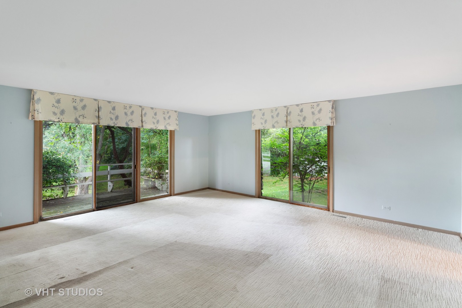 67 Round Barn Road Barrington Hills, IL 60010 - Photo 35 of 43 a view of an empty room with large windows