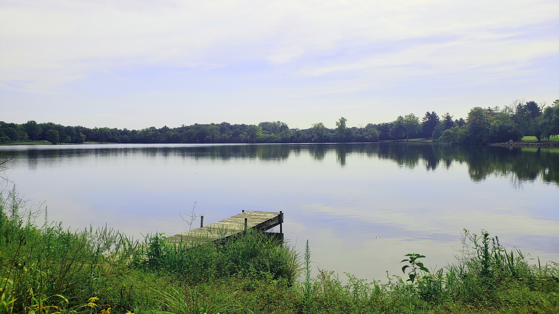 67 Round Barn Road Barrington Hills, IL 60010 - Photo 4 of 43 a lake with houses in the back