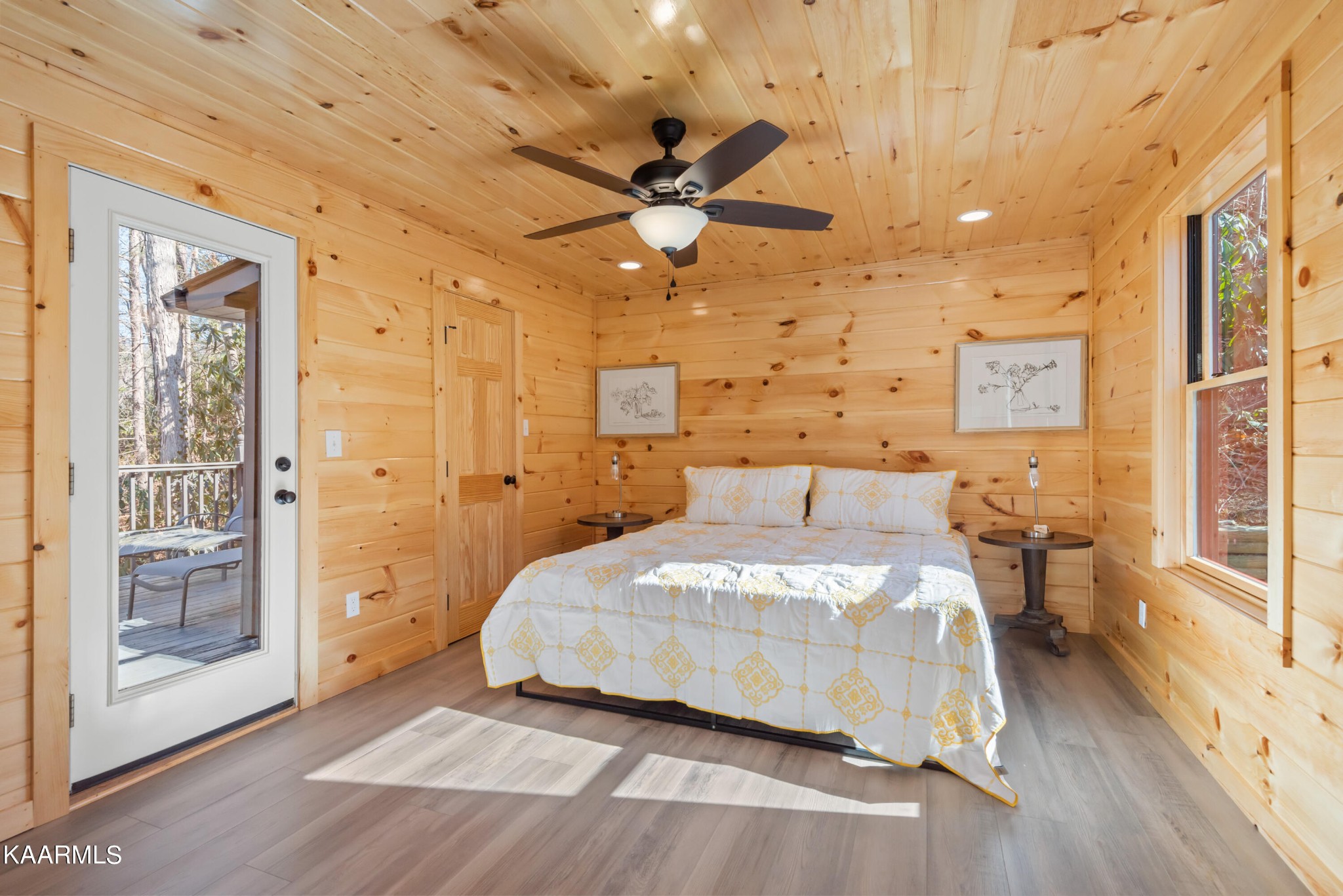 306 Glades Road Gatlinburg, TN 37738 - Photo 11 of 46 a bedroom with a bed and wooden floor