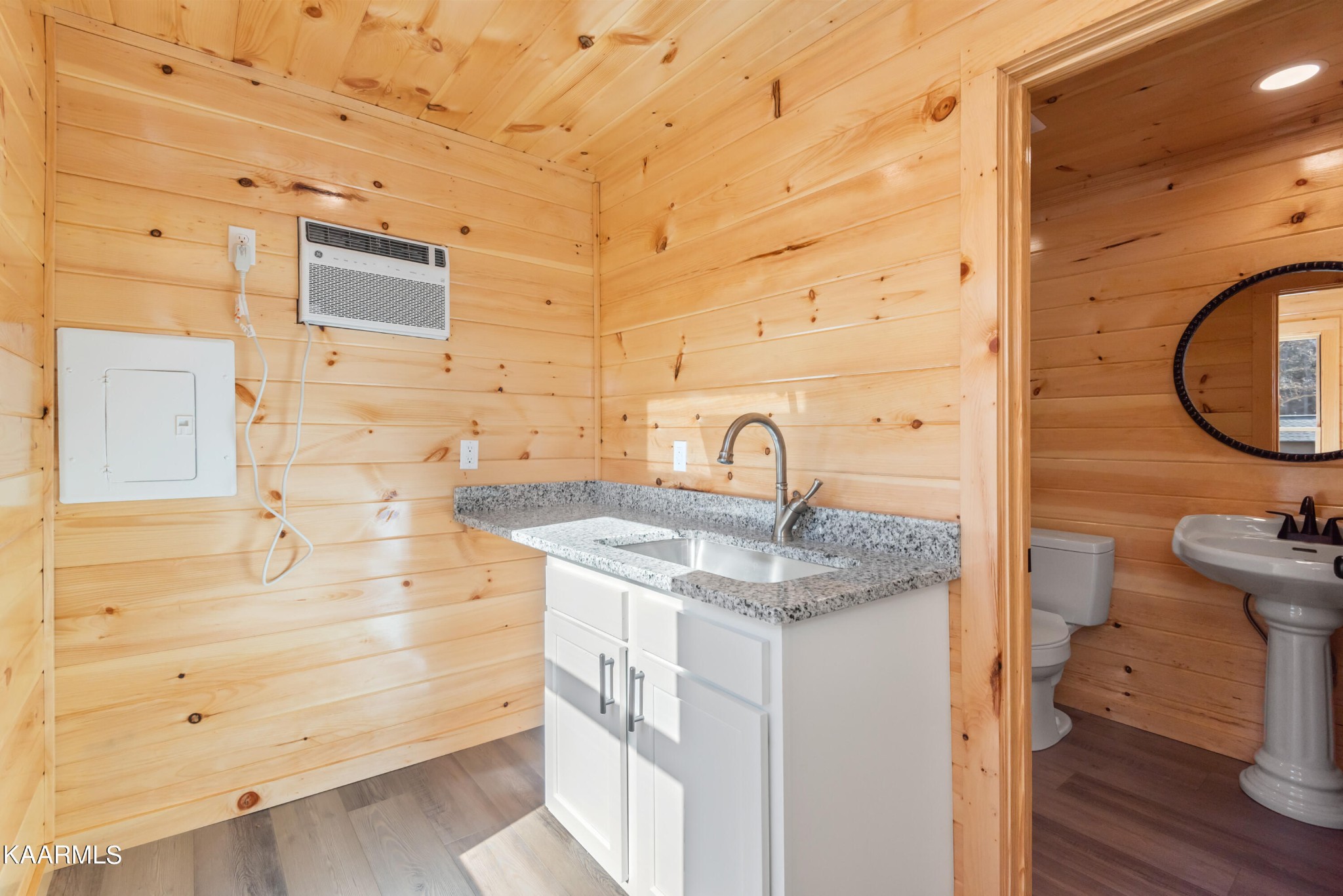 306 Glades Road Gatlinburg, TN 37738 - Photo 15 of 46 a bathroom with a sink a vanity and a mirror