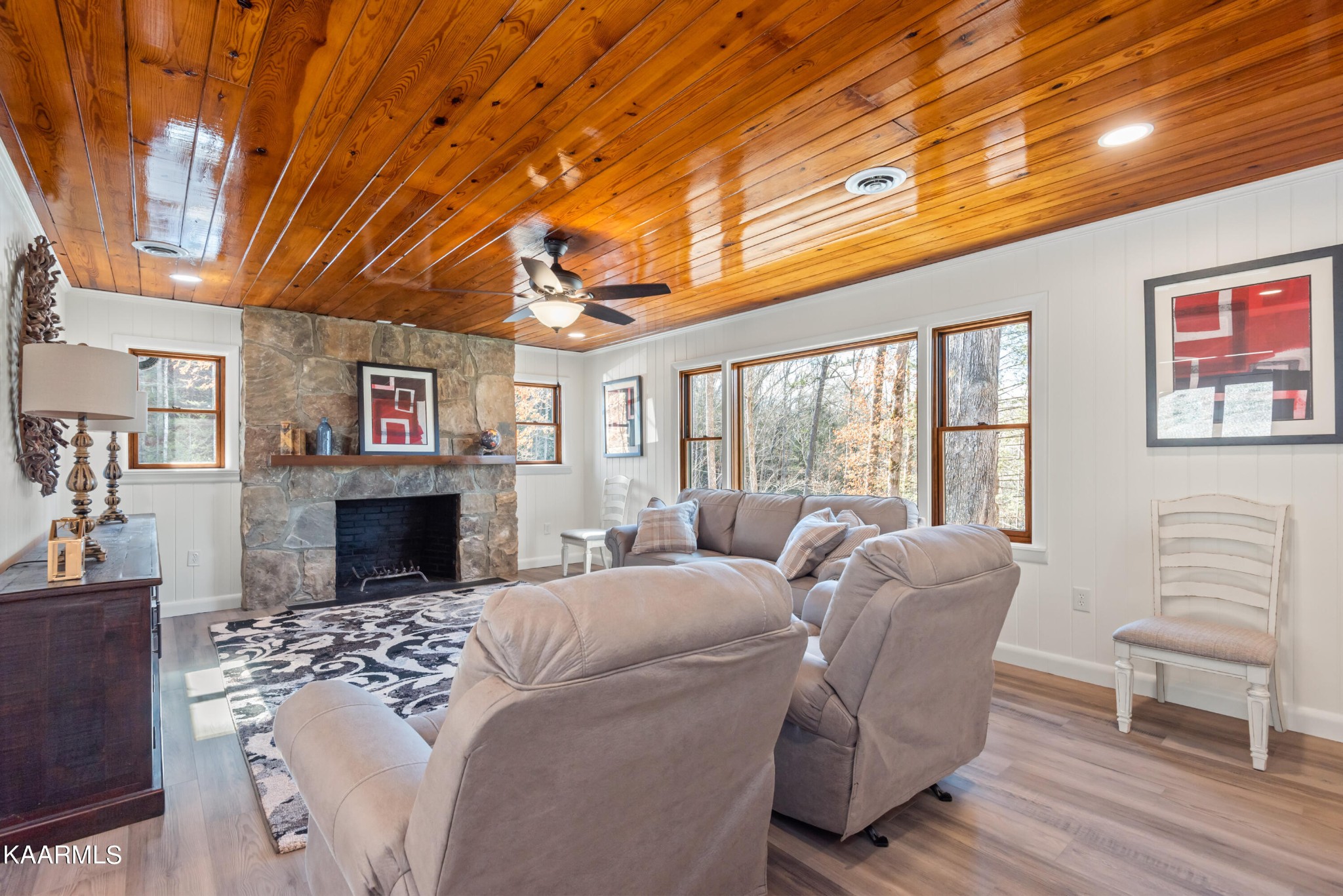 306 Glades Road Gatlinburg, TN 37738 - Photo 17 of 46 a living room with furniture a fireplace and a flat screen tv
