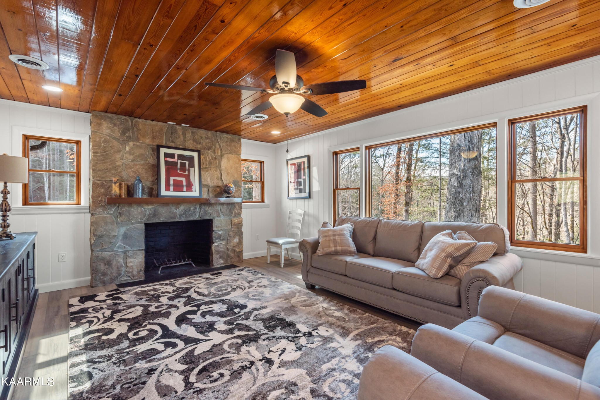 306 Glades Road Gatlinburg, TN 37738 - Photo 21 of 46 a living room with furniture a large window and a fireplace