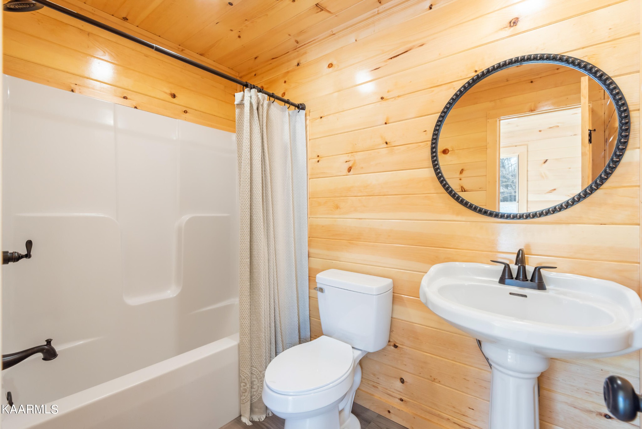 306 Glades Road Gatlinburg, TN 37738 - Photo 22 of 46 a bathroom with a sink a toilet and a mirror