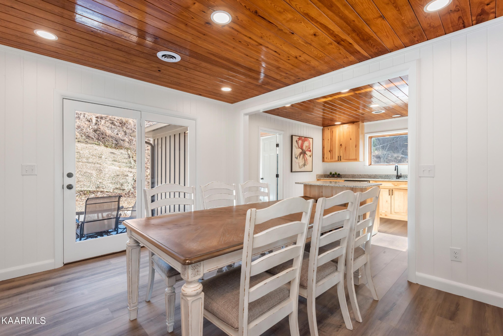 306 Glades Road Gatlinburg, TN 37738 - Photo 25 of 46 a view of a dining room with furniture wooden floor and a rug