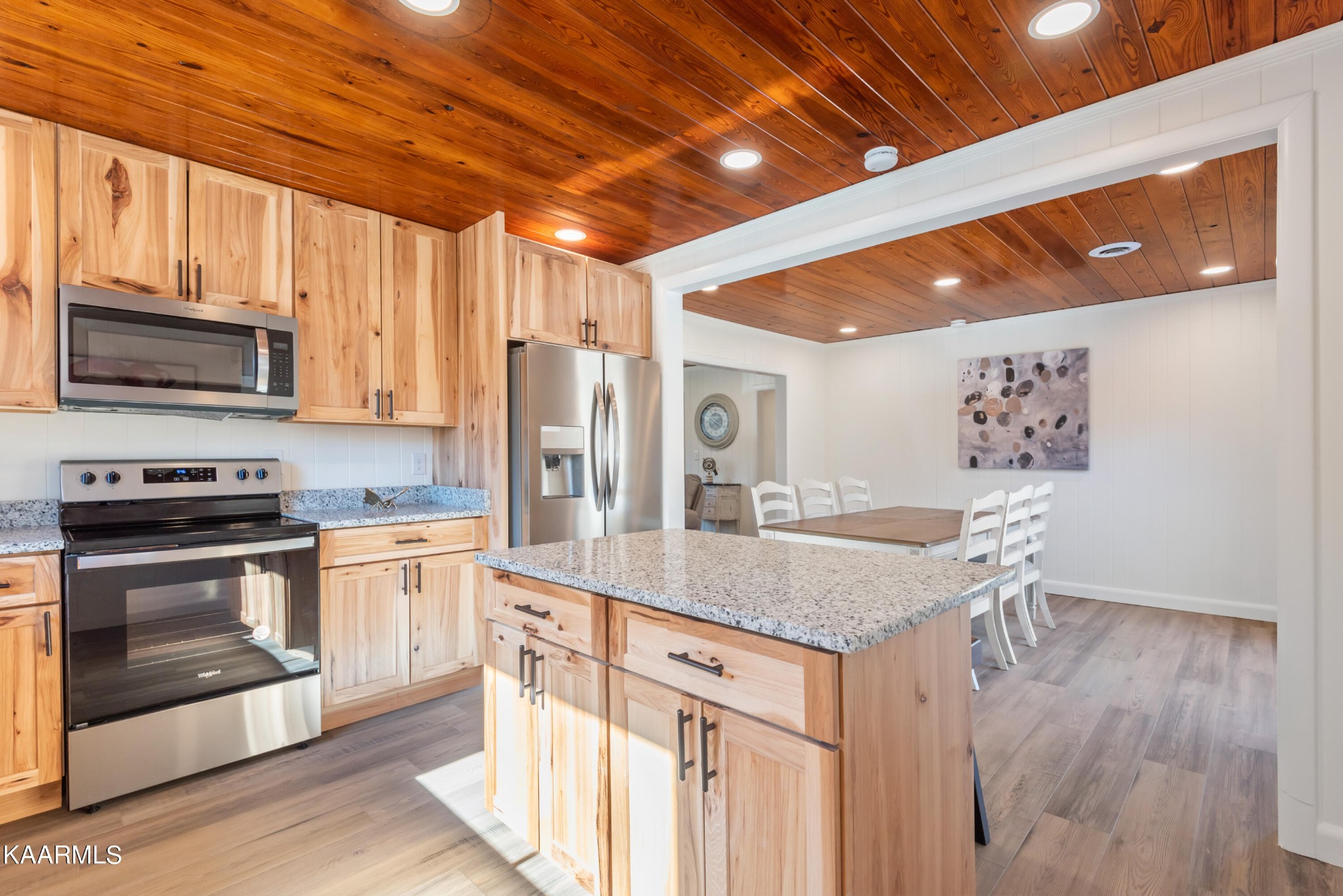 306 Glades Road Gatlinburg, TN 37738 - Photo 29 of 46 a kitchen with stainless steel appliances granite countertop a stove a refrigerator a sink and a microwave