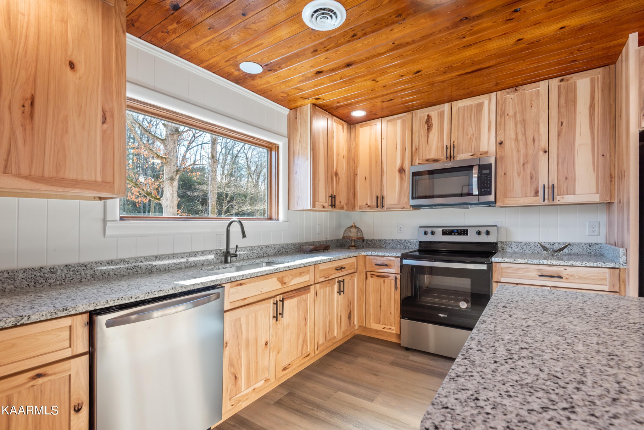 306 Glades Road Gatlinburg, TN 37738 - Photo 30 of 46 a kitchen with stainless steel appliances granite countertop a sink a stove and cabinets