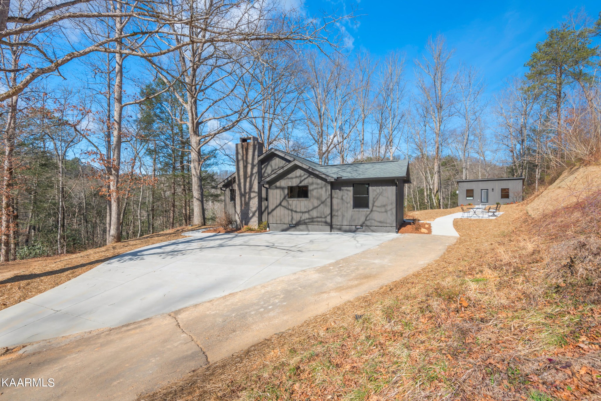 306 Glades Road Gatlinburg, TN 37738 - Photo 3 of 46 a view of a house with snow on the road