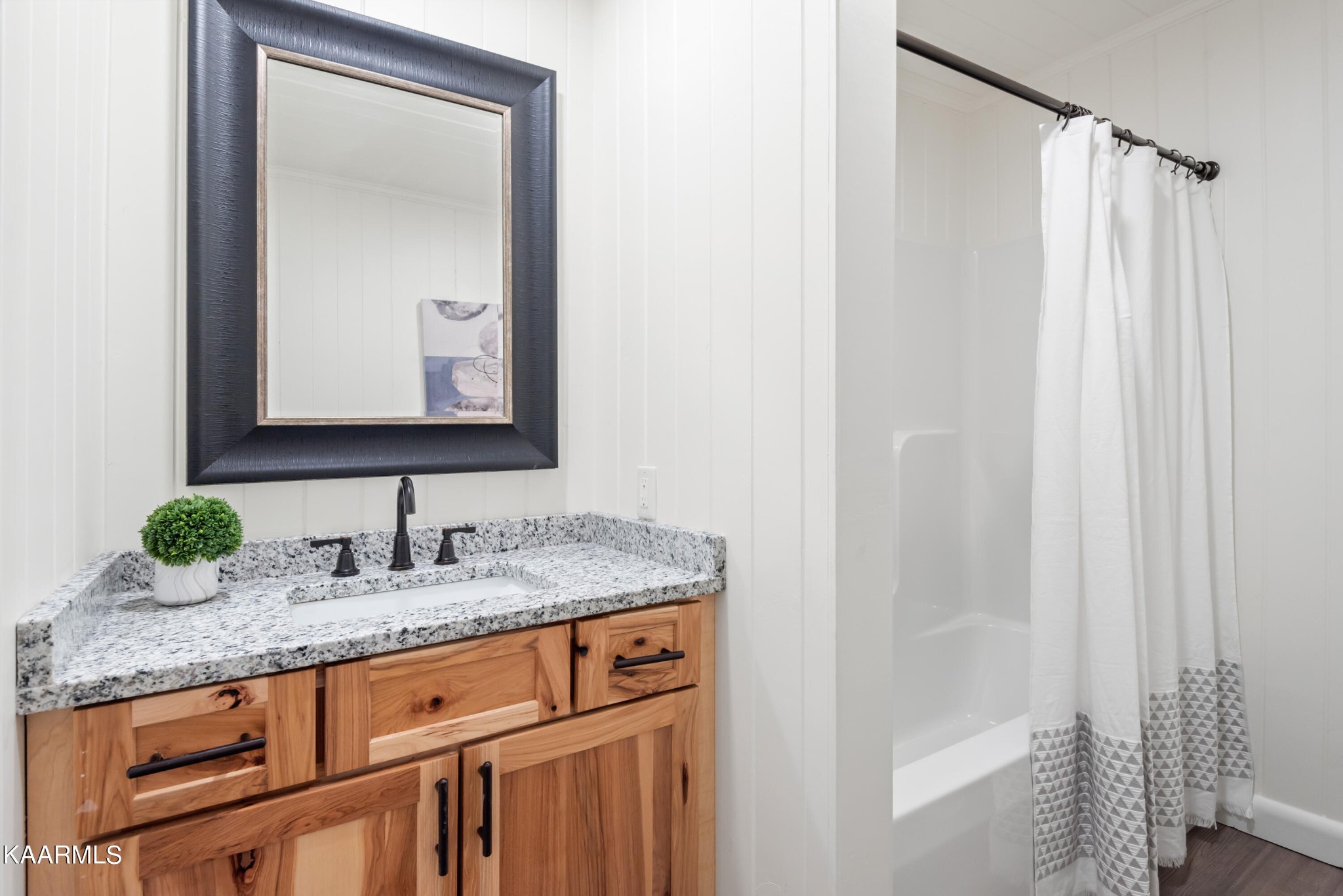 306 Glades Road Gatlinburg, TN 37738 - Photo 38 of 46 a bathroom with a granite countertop sink and a mirror
